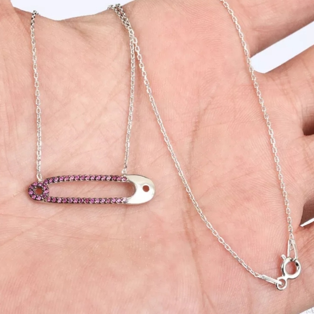 Sterling silver safety pin covered in rubies